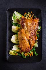 Image showing Peking duck breast with pak choi and vegetables