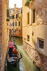 Image showing Venice, Italy. Tourists riding gondolas