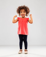Image showing happy little african american girl showing power