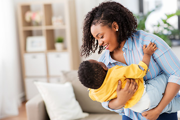 Image showing happy african american mother with baby at home