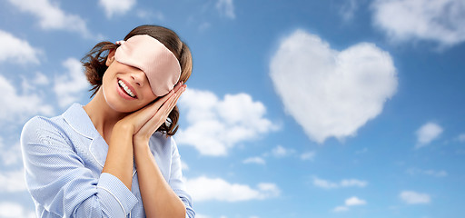 Image showing happy young woman in pajama and eye sleeping mask