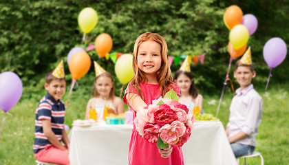 Image showing red haired girl with flowers at birthday party