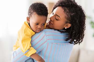 Image showing african american mother with sad baby at home