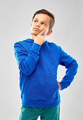 Image showing thinking boy in blue hoodie