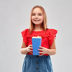 Image showing beautiful smiling girl in red shirt and skirt