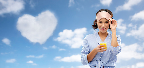 Image showing woman in pajama and sleeping mask with juice