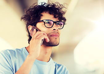 Image showing man with smartphone calling on city street