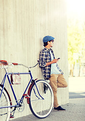 Image showing man with smartphone, earphones and bicycle