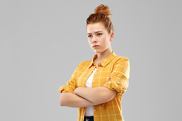 Image showing serious red haired teenage girl with crossed arms