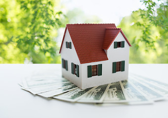 Image showing close up of home or house model and money