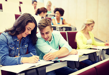 Image showing group of students with notebooks at lecture hall