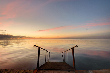 Image showing Beautiful view of the evening sea, in the foreground of the stairs descendinto the sea