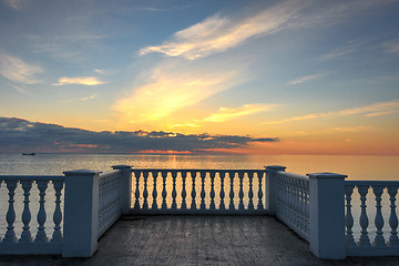 Image showing Beautiful building with columns on a landscaped promenade at sunset