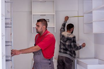 Image showing workers installing a new kitchen