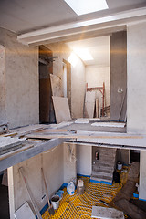 Image showing yellow underfloor heating installation with white pipes