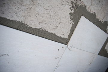 Image showing Ceramic tiles and tools for tiler