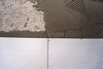 Image showing Ceramic tiles and tools for tiler