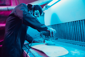 Image showing Skater in process of making his own skateboard, longboard - open business concept