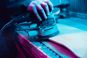 Image showing Skater in process of making his own skateboard, longboard - open business concept