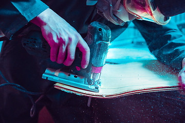 Image showing Skater in process of making his own skateboard, longboard - open business concept