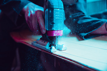 Image showing Skater in process of making his own skateboard, longboard - open business concept