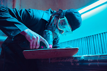 Image showing Skater in process of making his own skateboard, longboard - open business concept