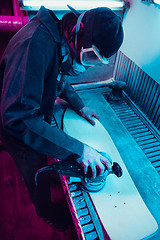 Image showing Skater in process of making his own skateboard, longboard - open business concept