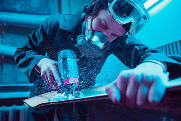 Image showing Skater in process of making his own skateboard, longboard - open business concept