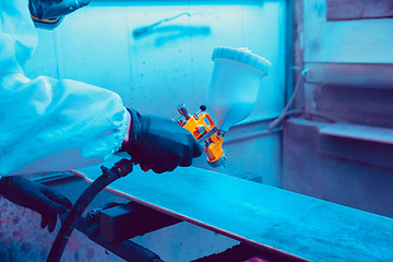 Image showing Skater in process of making his own skateboard, longboard - open business concept