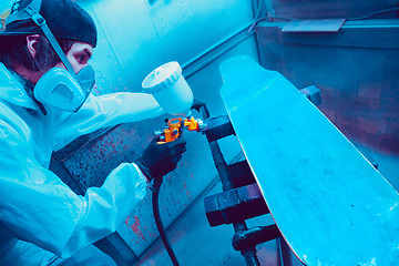 Image showing Skater in process of making his own skateboard, longboard - open business concept