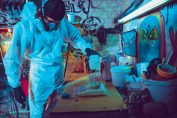 Image showing Skater in process of making his own skateboard, longboard - open business concept