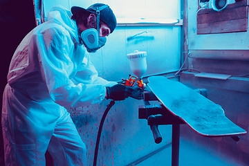 Image showing Skater in process of making his own skateboard, longboard - open business concept