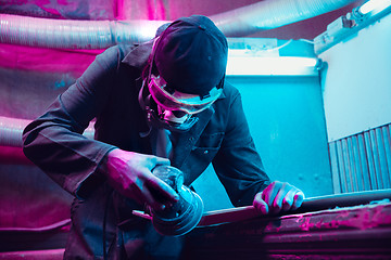 Image showing Skater in process of making his own skateboard, longboard - open business concept