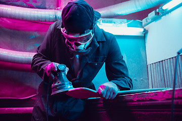 Image showing Skater in process of making his own skateboard, longboard - open business concept