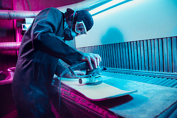 Image showing Skater in process of making his own skateboard, longboard - open business concept