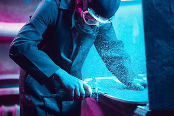 Image showing Skater in process of making his own skateboard, longboard - open business concept