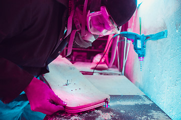 Image showing Skater in process of making his own skateboard, longboard - open business concept