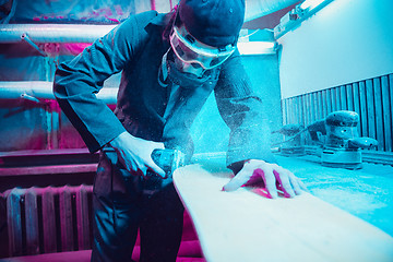 Image showing Skater in process of making his own skateboard, longboard - open business concept