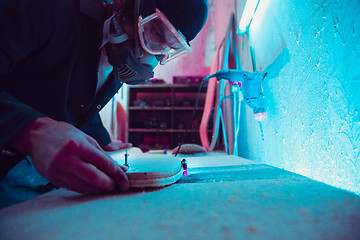 Image showing Skater in process of making his own skateboard, longboard - open business concept