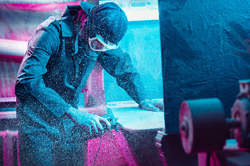 Image showing Skater in process of making his own skateboard, longboard - open business concept