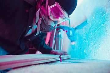 Image showing Skater in process of making his own skateboard, longboard - open business concept