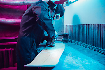 Image showing Skater in process of making his own skateboard, longboard - open business concept