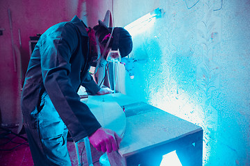 Image showing Skater in process of making his own skateboard, longboard - open business concept