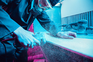 Image showing Skater in process of making his own skateboard, longboard - open business concept