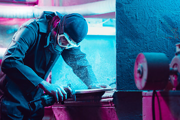 Image showing Skater in process of making his own skateboard, longboard - open business concept