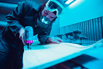 Image showing Skater in process of making his own skateboard, longboard - open business concept