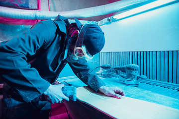 Image showing Skater in process of making his own skateboard, longboard - open business concept