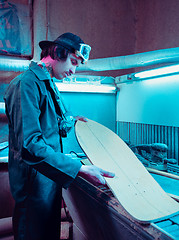 Image showing Skater in process of making his own skateboard, longboard - open business concept