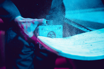 Image showing Skater in process of making his own skateboard, longboard - open business concept