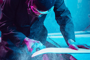 Image showing Skater in process of making his own skateboard, longboard - open business concept